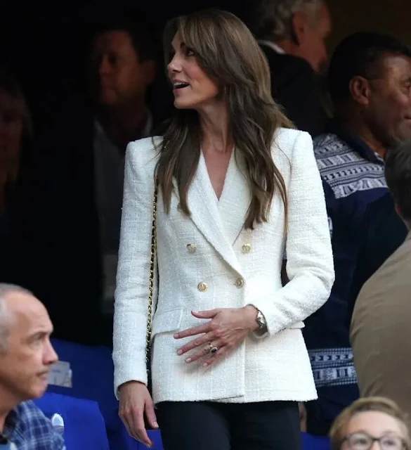 Princess of Wales wore a textured double breasted blazer by Zara. Accessorize twisted circle drop earrings