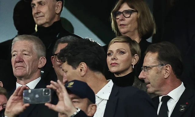 Princess Charlene wore a new Max Mara coat. She wore a gold earrings and a ring by Repossi Antifer