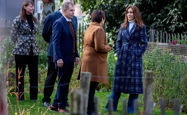 Crown Princess Mary wore a Meghan check wrap coat by Hobbs. White turtleneck cashmere sweater and jeans pants