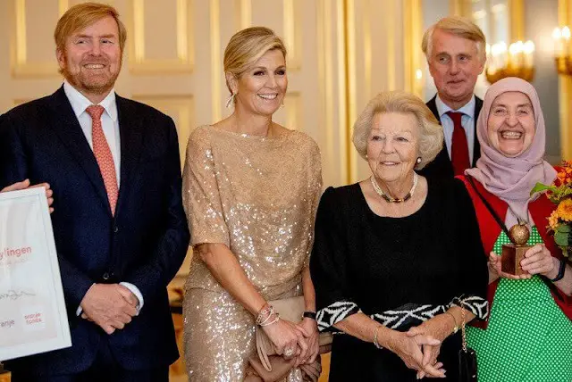 Queen Maxima wore a beige, cream sequin midi dress by Natan. King Willem-Alexander and Princess Beatrix