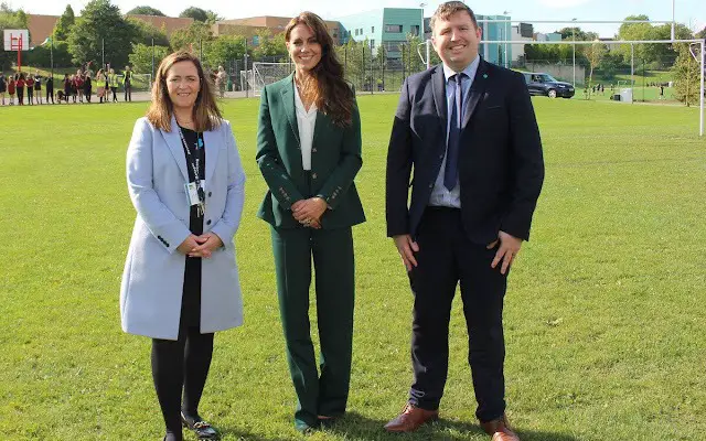 Kate, Princess of Wales wore a green single-breasted tailored blazer by Burberry. Holland Cooper Cupro white shirt bodysuit