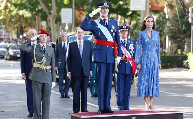 Queen Letizia wore blue printed long sleeve v-neck midi dress by Juan Vidal. Crown Princess Leonor and King Felipe