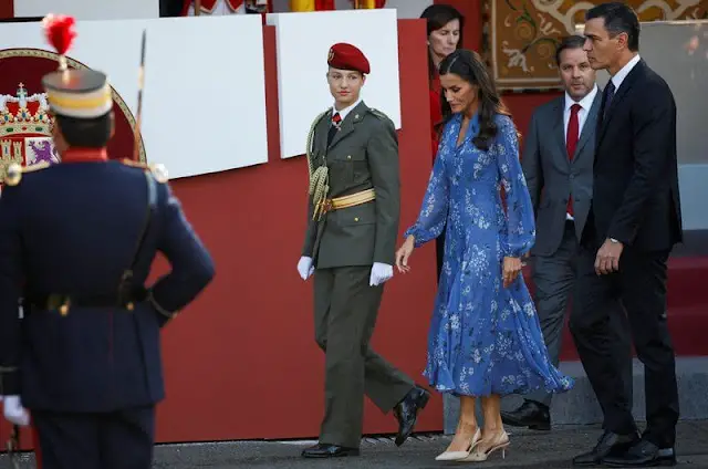 Queen Letizia wore blue printed long sleeve v-neck midi dress by Juan Vidal. Crown Princess Leonor and King Felipe