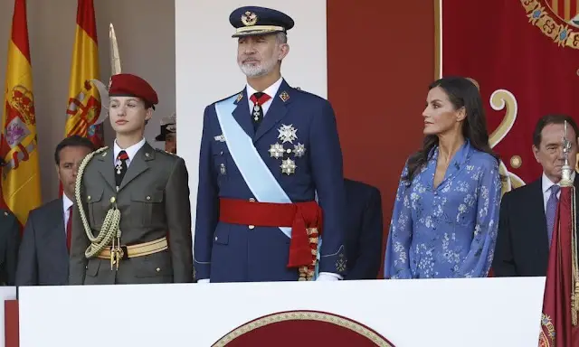 Queen Letizia wore blue printed long sleeve v-neck midi dress by Juan Vidal. Crown Princess Leonor and King Felipe