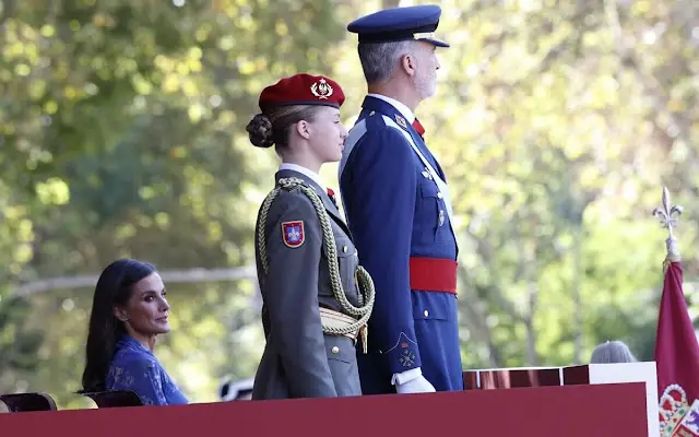 Queen Letizia wore blue printed long sleeve v-neck midi dress by Juan Vidal. Crown Princess Leonor and King Felipe