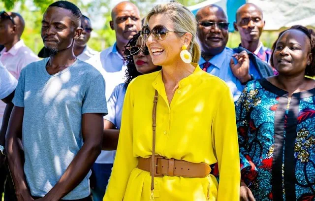 Queen Maxima wore Max Mara yellow poplin shirt and Ginosa yellow pants. Giuseppe Zanotti ballerina flat. Mango Raffia earrings