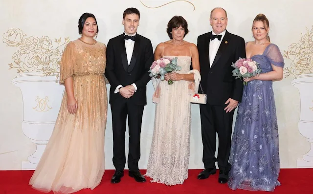 Camille Gottlieb wore a Paz dress by Carolina Soma. Marie Ducruet wore a Parisa gown by Jenny Packham. Princess Stephanie