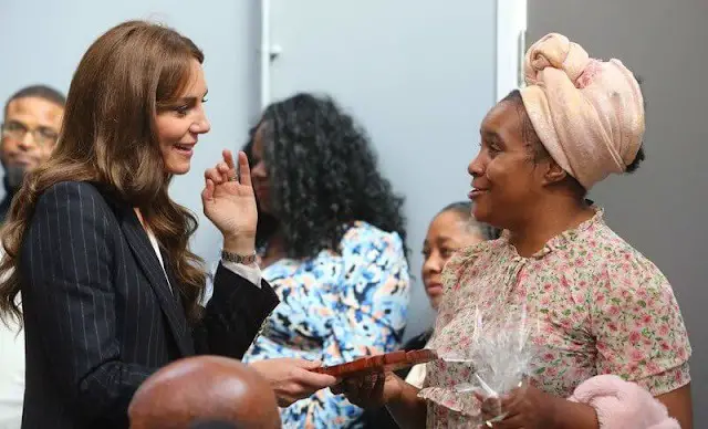 Princess of Wales wore a double-breasted stripe suit and a Cupro shirt bodysuit by Holland Cooper. Shyla earrings