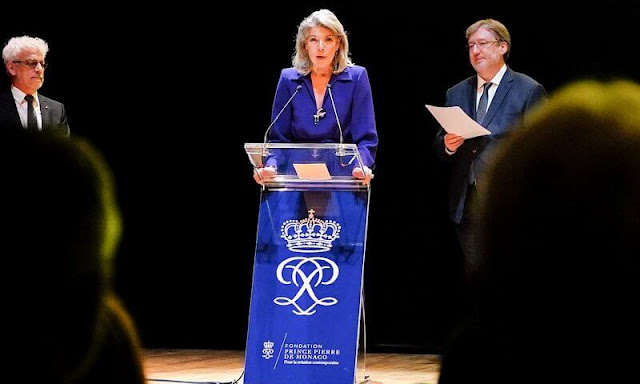 Princess Caroline wore a purple belted crepe maxi dress by Dries van Noten. Charlotte Casiraghi wore a pink top and pants