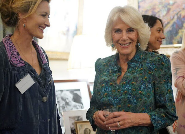 Queen Camilla wore a printed dress by Fiona Clare Aldridge. Eliot Zed Serra navy textured pumps