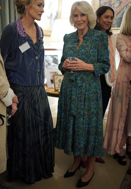 Queen Camilla wore a printed dress by Fiona Clare Aldridge. Eliot Zed Serra navy textured pumps