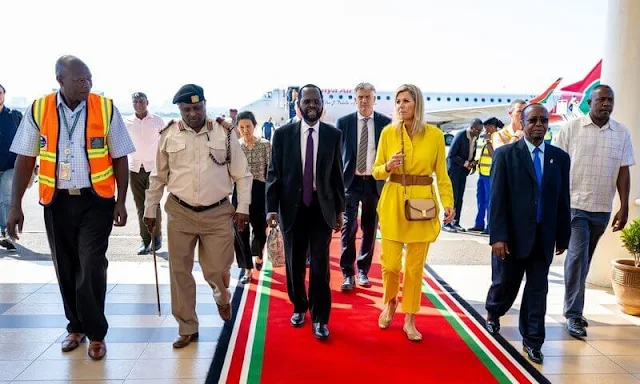 Queen Maxima wore Max Mara yellow poplin shirt and Ginosa yellow pants. Giuseppe Zanotti ballerina flat. Mango Raffia earrings