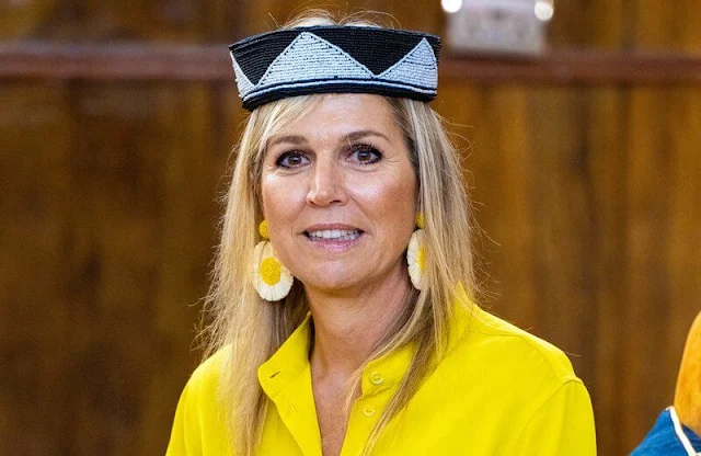 Queen Maxima wore Max Mara yellow poplin shirt and Ginosa yellow pants. Giuseppe Zanotti ballerina flat. Mango Raffia earrings