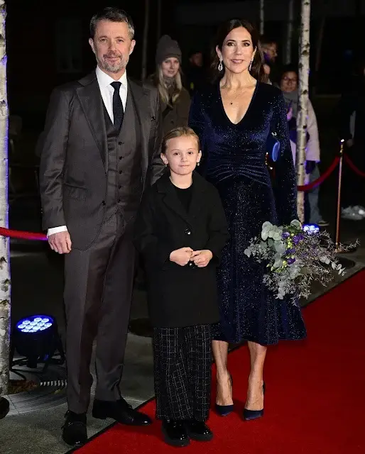 Crown Princess Mary is wearing a Rotate Birger Christensen velvet glitter midi dress. Gianvito Rossi pumps and Prada clutch