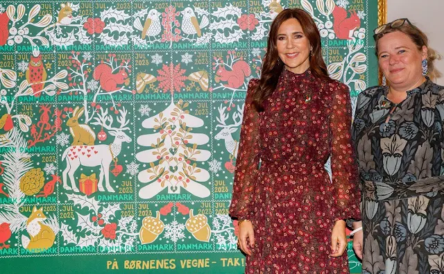 Crown Princess Mary wore a new Jacqui B akina wine dress by Saloni. Count Ingolf and Countess Sussie of Rosenborg