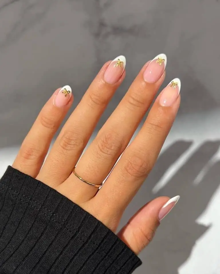 Classic French Manicure with Elegant Gold Bows