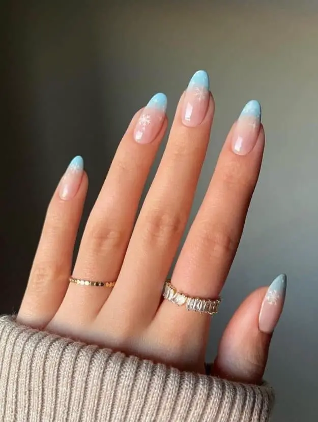 Icy Blue Ombre Nails with Snowflake Embellishments