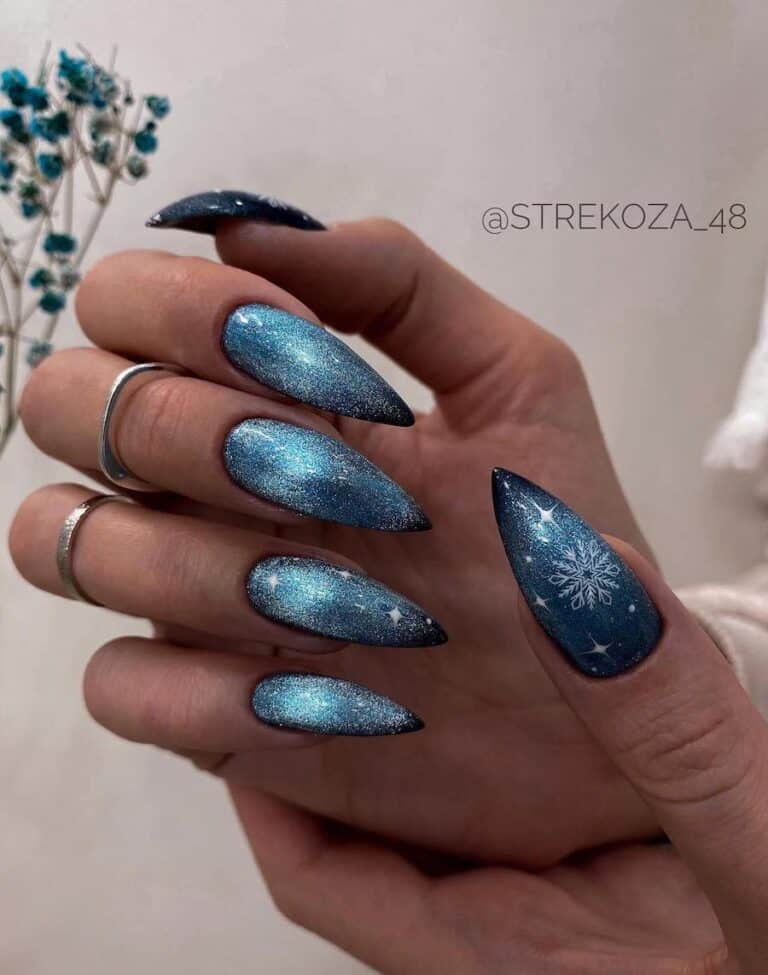 Blue Cat Eye Nails with Delicate Snowflakes for a Unique Look"