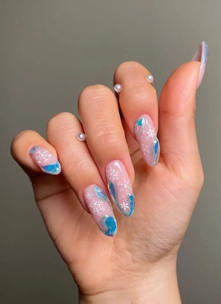 Icy Blue Wave Nails adorned with Beautiful Snowflakes