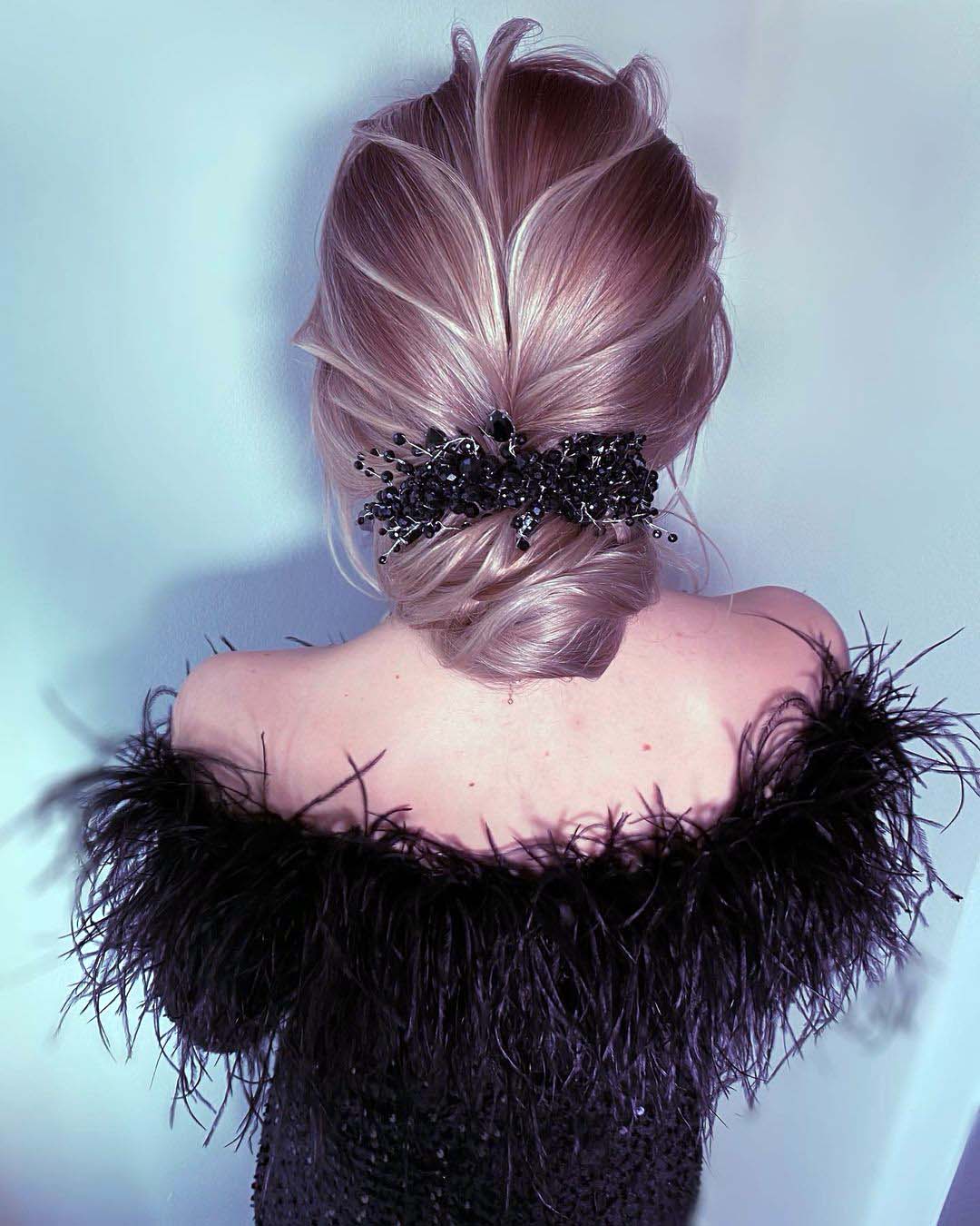 winter wedding hairstyles low bun with black headpiece lidia_szadkowska