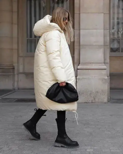 City Chic: White Long Puffer Jacket, Black Leggings, and Lug Boots Ensemble