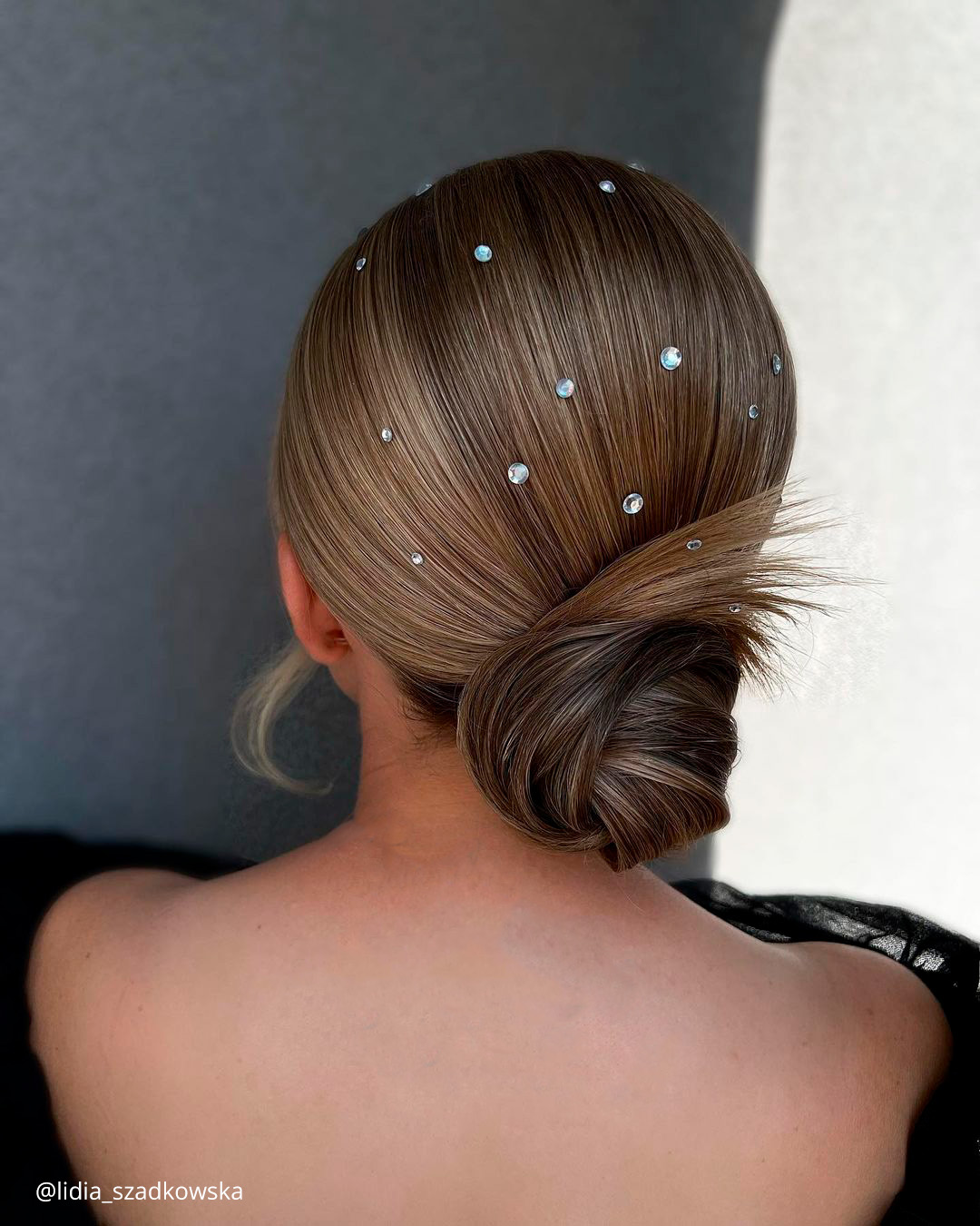 winter wedding hairstyles smooth low bun with crystals lidia szadkowska