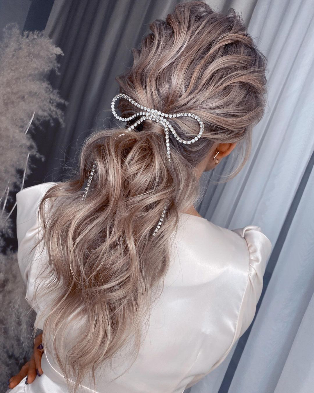 winter wedding hairstyles long ponytail with crystal bow headpiece olga_nikiforova_hair