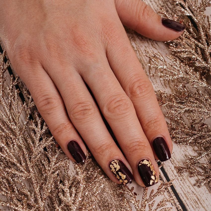 Burgundy Nails with Gold Flecks: Rich and Luxurious