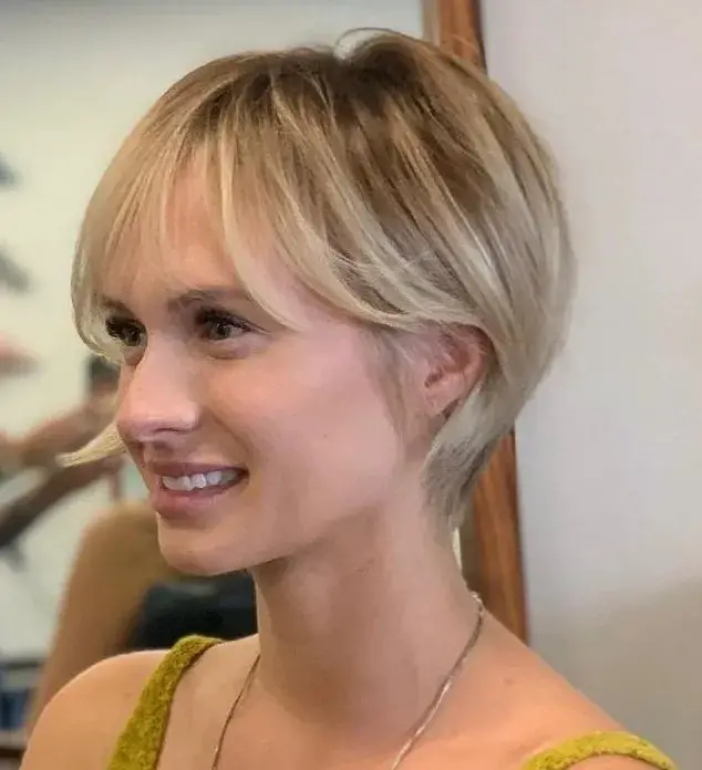 Charming Pixie Cut with Wispy Bangs: A Delicate Look for Thinner Strands