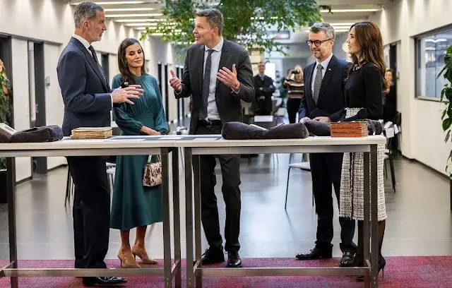 Queen Letizia wore a green midi dress by Dandara, and Carolina herrera coat. Princess Mary wore a Red Valentino top