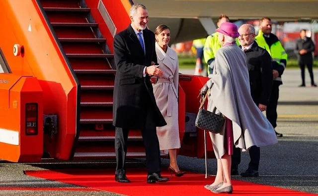 Queen Letizia wore long belted wool coat by & Other Stories. Crown Princess Mary wore a green coat by The Fold