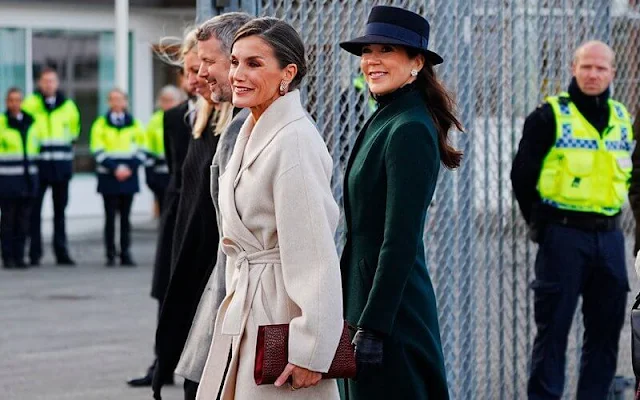 Queen Letizia wore long belted wool coat by & Other Stories. Crown Princess Mary wore a green coat by The Fold