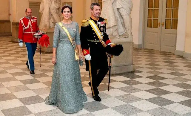 Queen Letizia wearing Felipe Varela navy gown. Crown Princess Mary wearing Lasse Spangenberg gown