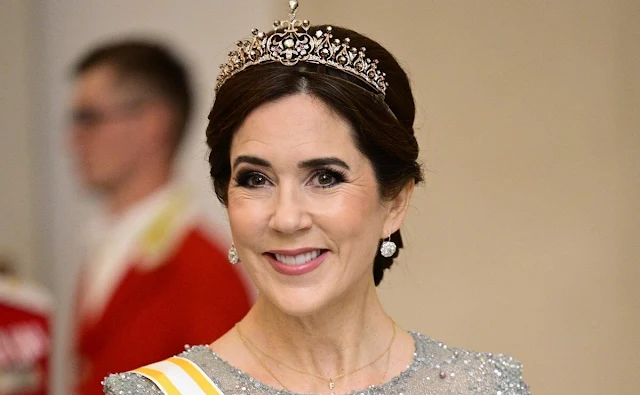 Queen Letizia wearing Felipe Varela navy gown. Crown Princess Mary wearing Lasse Spangenberg gown