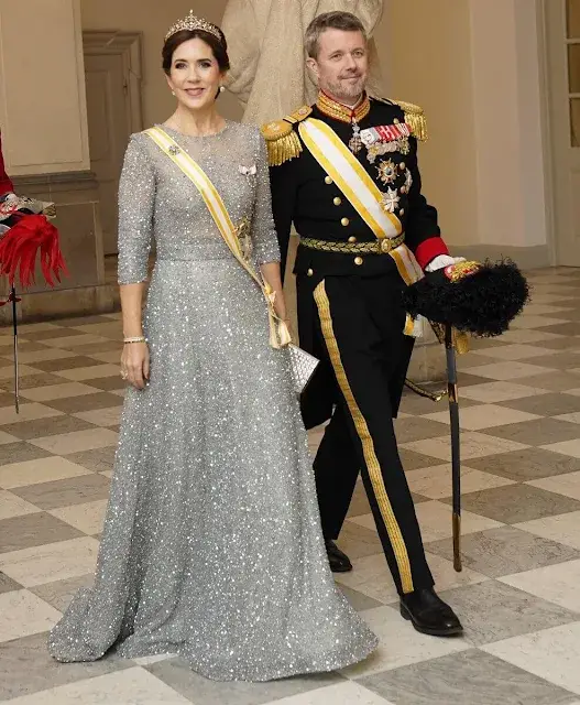 Queen Letizia wearing Felipe Varela navy gown. Crown Princess Mary wearing Lasse Spangenberg gown