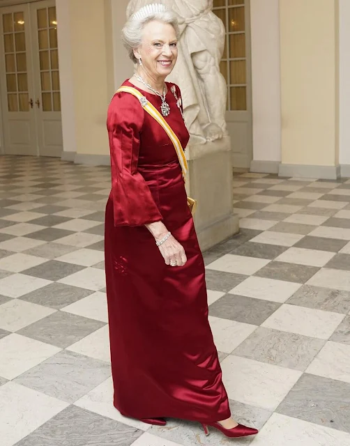 Queen Letizia wearing Felipe Varela navy gown. Crown Princess Mary wearing Lasse Spangenberg gown