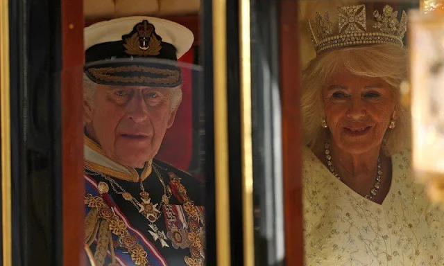 King Charles wearing the Imperial State Crown and the Robe of State, Queen Camilla, wearing the George IV State Diadem