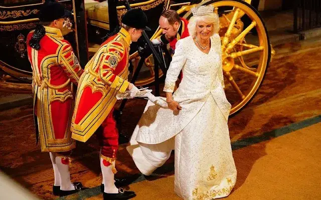 King Charles wearing the Imperial State Crown and the Robe of State, Queen Camilla, wearing the George IV State Diadem