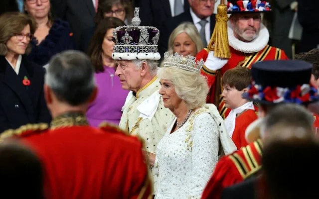 King Charles wearing the Imperial State Crown and the Robe of State, Queen Camilla, wearing the George IV State Diadem