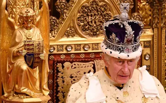 King Charles wearing the Imperial State Crown and the Robe of State, Queen Camilla, wearing the George IV State Diadem