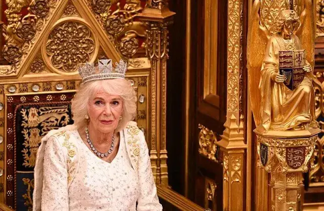 King Charles wearing the Imperial State Crown and the Robe of State, Queen Camilla, wearing the George IV State Diadem