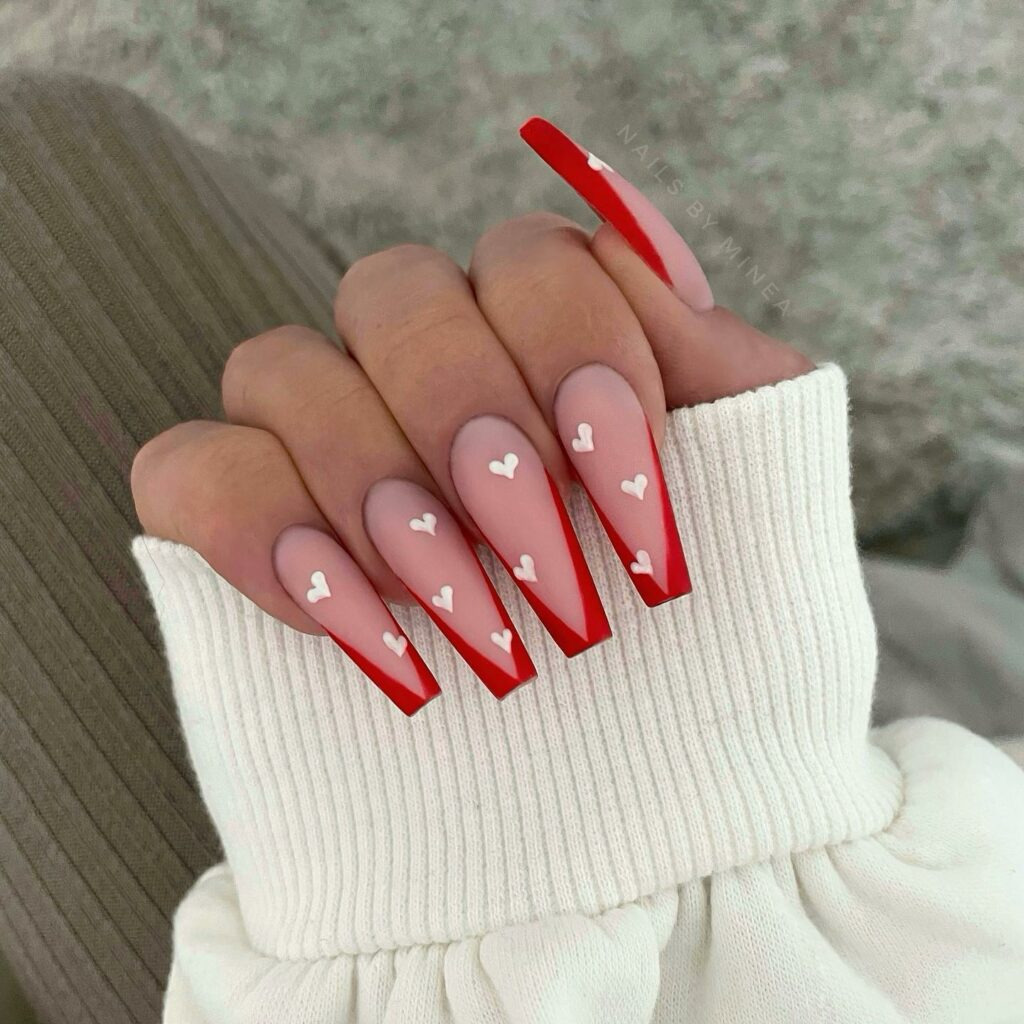 Valentine's Day Nail Ideas 2024: Elegant Hearts on Gradient Red and Pink Nails: A Stunning Look