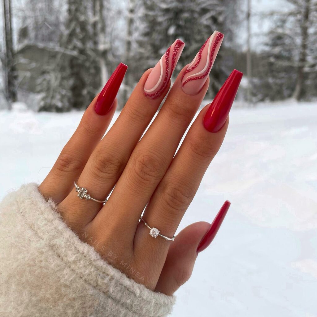 Valentine's Day Nail Ideas 2024: Ruby Reds with Snowy Swirls: Mesmerizing Pink Nail Accents