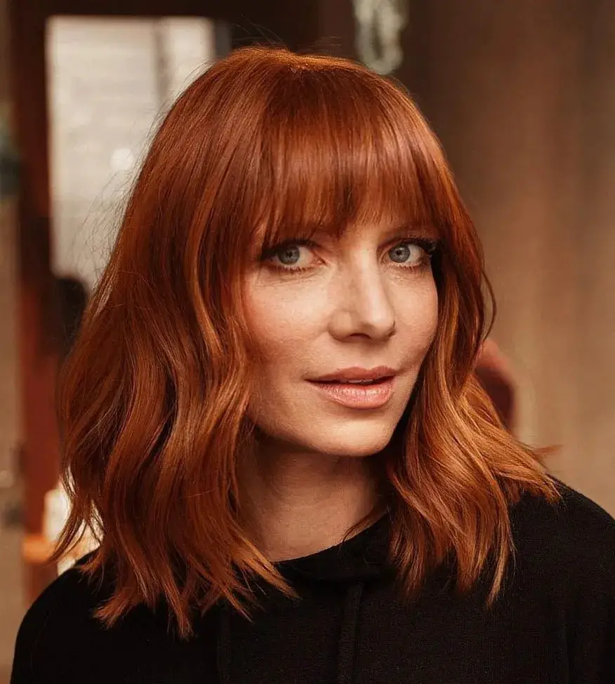 Straight and Striking: Copper Locks with Full Bangs