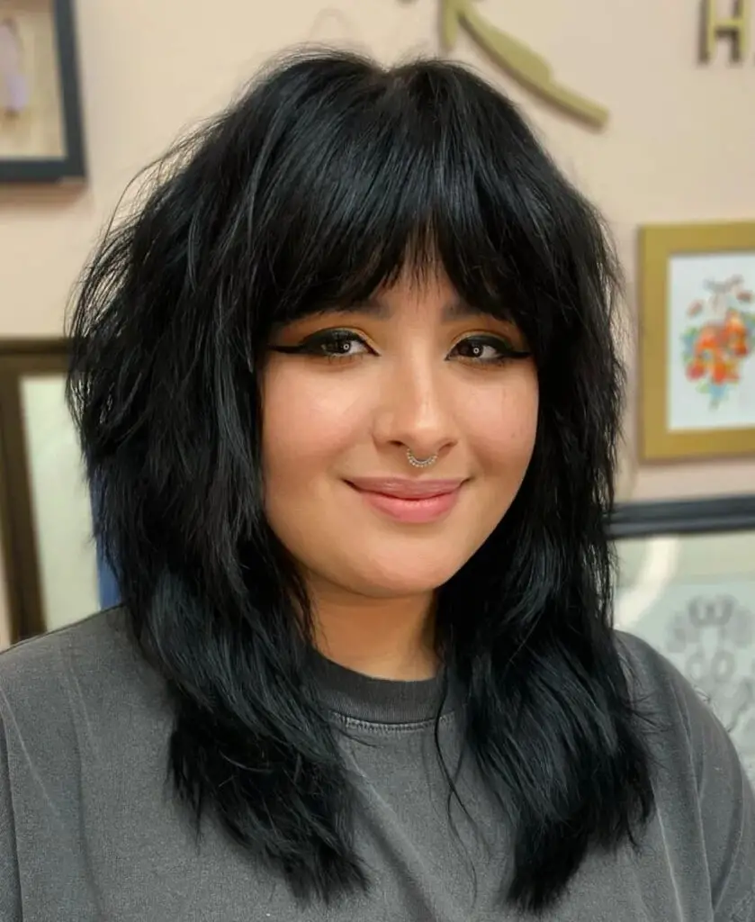 Medium-Length Hairstyles with Bangs: Amp Up Volume with a Voluminous Layered Hairstyle