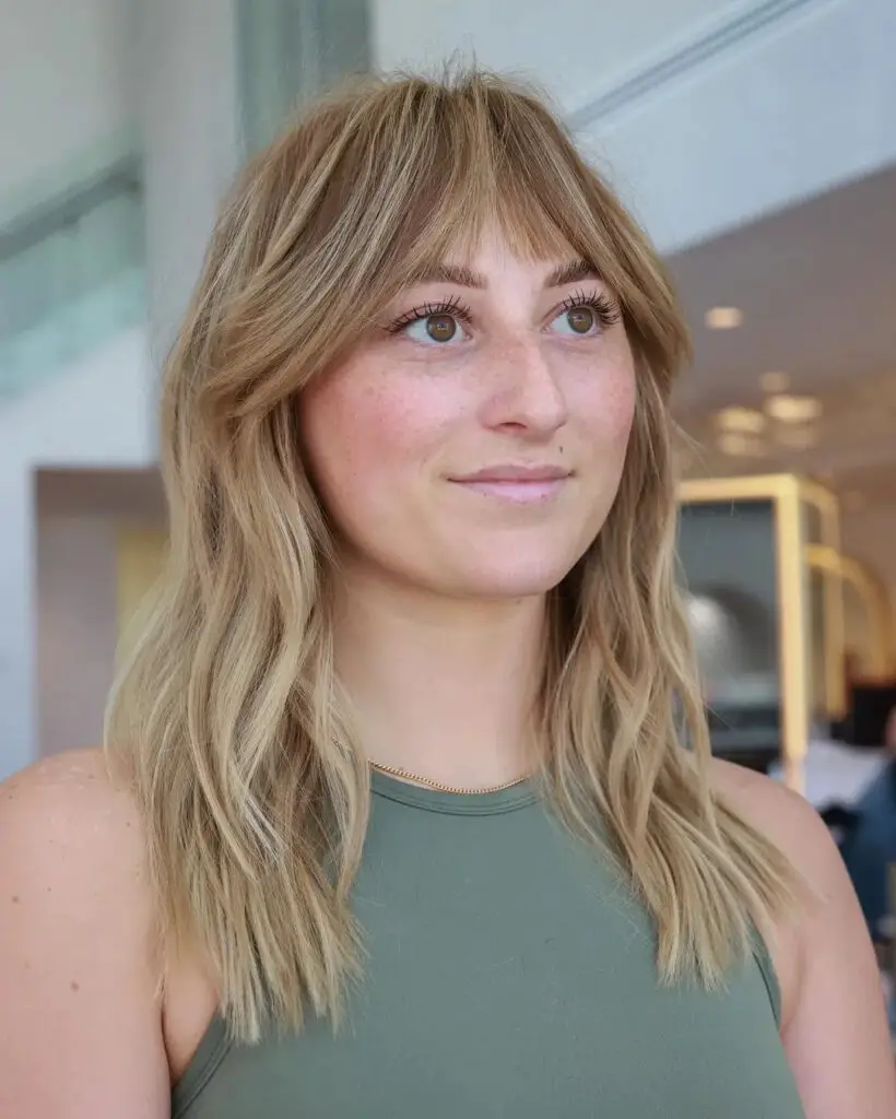 Medium Waves with Feathered Bangs: Effortless Chic