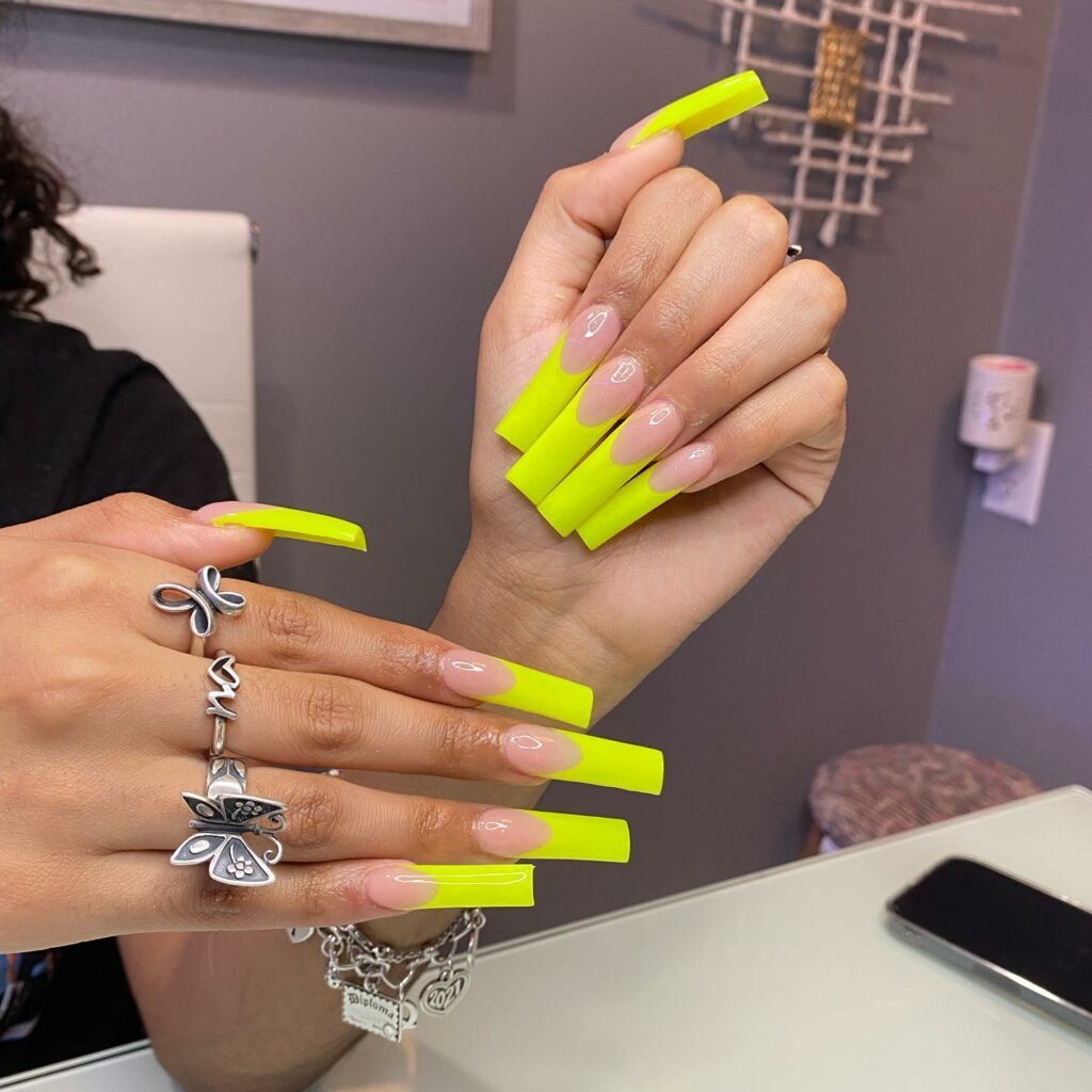 Showcasing Long Neon Yellow French Nails - Nail Design Trends