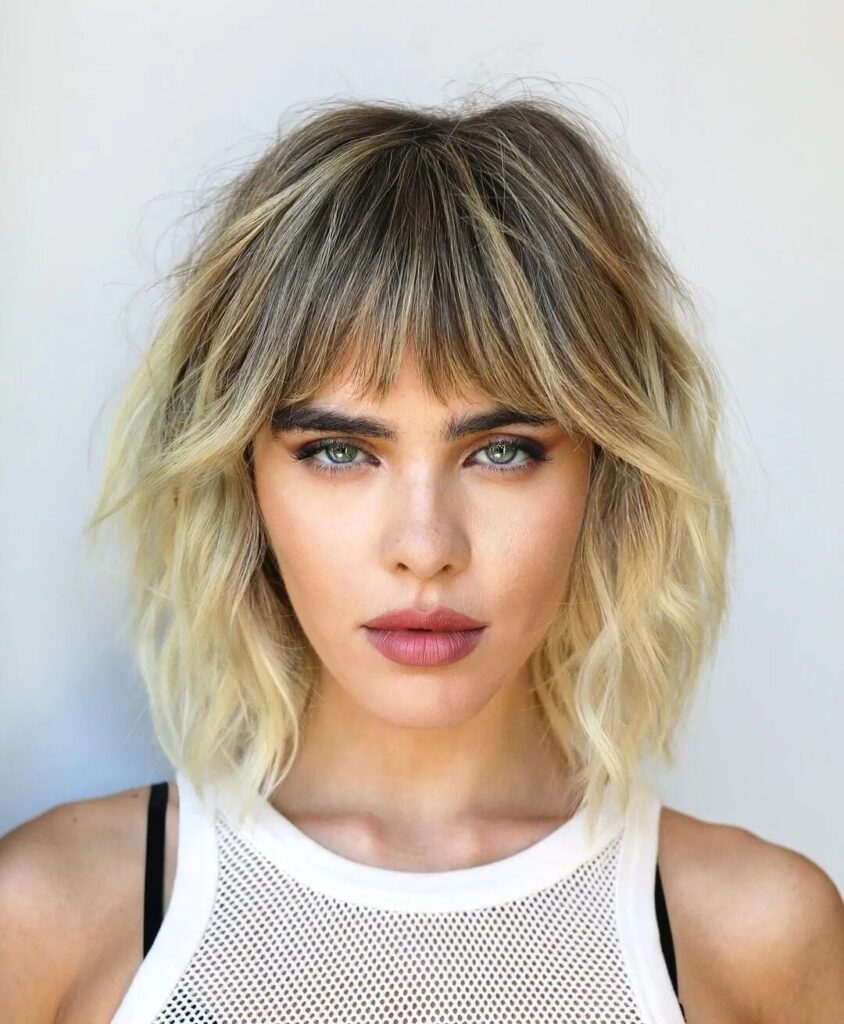 Best Haircuts For Triangle Face Shape; Shag with Choppy Bangs