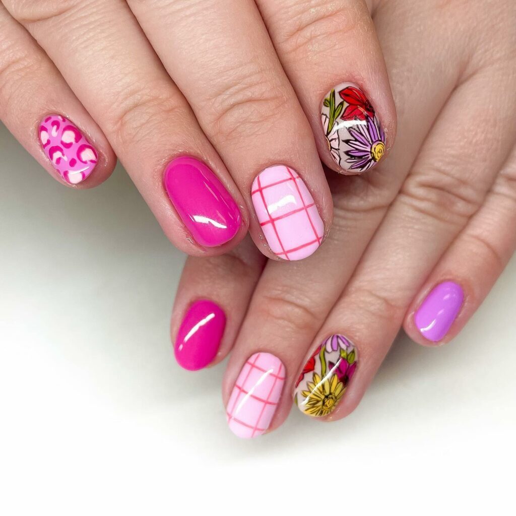 Short Valentine’s Nail Designs 2024 / Playful Patterns: Pink Short Valentine’s Nails Featuring Plaids and Flowers