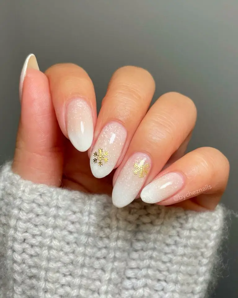 Winter Almond Nails with Gold Snow Flakes Design